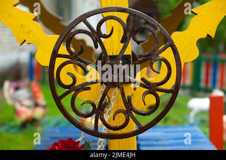 Spindle wheel. Metal circle. Round wrought iron. Well handle. Stock Photo