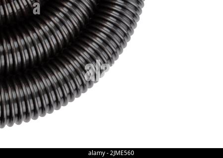 black plastic corrugated vacuum cleaner hose on white background Stock Photo