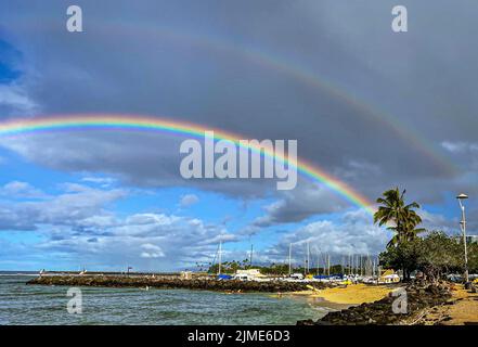 Honolulu, Hawaii - Nov 6, 2021-Double rainbow over beach in Oahu, Hawaii. Stock Photo