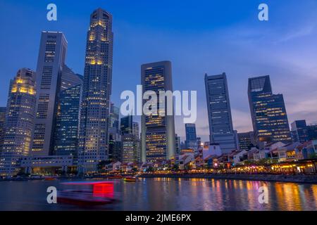 Twilight on the Quay of Singapore with Skyscrapers Stock Photo