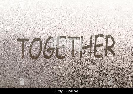 together written on a foggy window Stock Photo