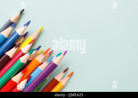 Background with colored pencils and space for copying. Top view. Stock Photo