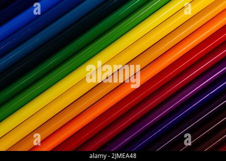 Colored gradient of pencils. Solid abstract background with color tone transition. Diagonal direction of lines. Stock Photo