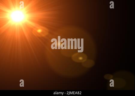 Lens flare and light beam on dark background orange color style. Lens Flare ,Sun Flare on black background. Optical Flare effect illustration. lens ef Stock Photo