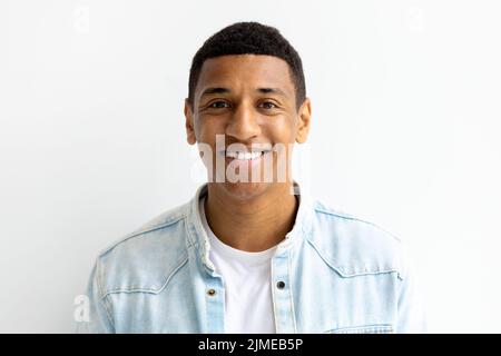 happy smiling man looking at the camera and smiles friendly Young African American male student smile joyfully Stock Photo
