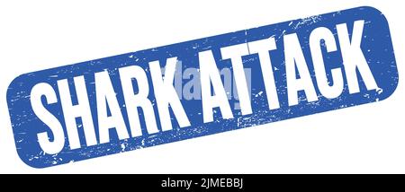 SHARK ATTACK text written on blue grungy stamp sign. Stock Photo