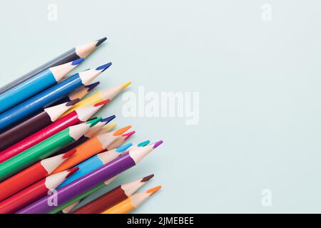 Background with colored pencils and space for copying. Top view. Stock Photo