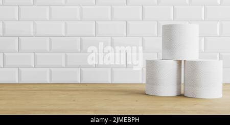 Toilet paper rolls on wooden and white tile background. Toilet paper roll on a table, background Stock Photo