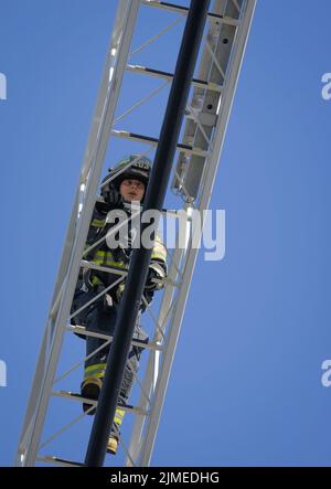 (220806) -- VANCOUVER, Aug. 6, 2022 (Xinhua) -- A student learns how to climb a ladder during the firefighter training camp at a fire department's training facility in Vancouver, British Columbia, Canada, on Aug. 5, 2022. Some of 27 female high school students from across British Columbia participated in the three full days of training at the fire department's training facilities, learning different tasks in firefighting and first response skills. The training camp is a youth firefighter mentorship program aimed to attract more young females to pursue their future career as firefighters a Stock Photo