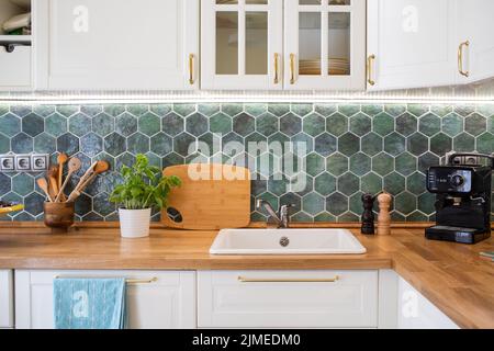 Modern kitchen interior with white furniture home background Stock Photo