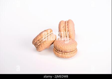 macarons, confectionery sweet product, three pink macarons isolated on white background Stock Photo