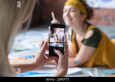 art photo shooting lady posing floor paint brush Stock Photo
