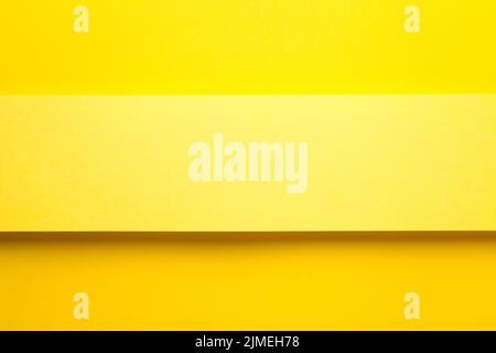 Yellow Paper Banner On Yellow Paper Background Stock Photo
