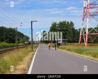 Two cyclists on the Wixhausen section of the Darmstadt-Frankfurt cycle express way, Egelsbach, Germany Stock Photo