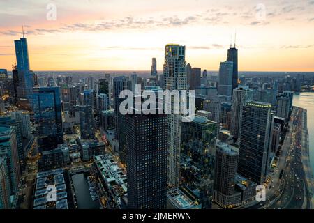 An aerial view of Chicago cityscape under colorful sunset sky Stock Photo