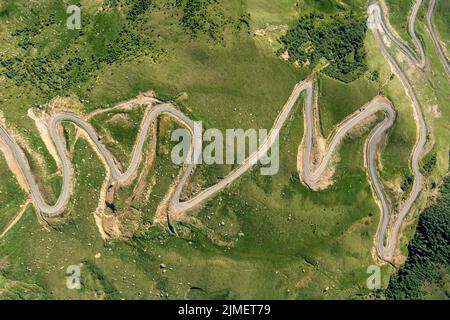 Winding road passing through mountain Stock Photo