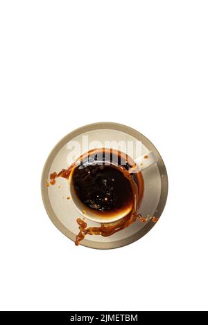 Coffee splash out of a cup isolated on a transparent background. Coffee break concept. Top view Stock Photo