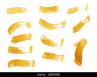 Set Of Golden Paint Strokes Isolated White Stock Photo