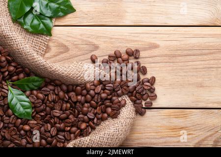 Coffee Beans In The Jute On Wood Stock Photo