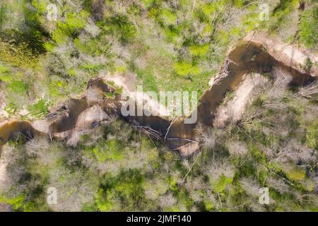 Aerial top down view of bendy river in spring Stock Photo