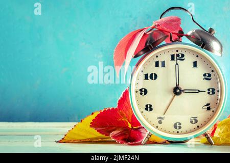 Daylight Saving Time concept, DST, fall back in autumn. A vintage alarm clock Stock Photo