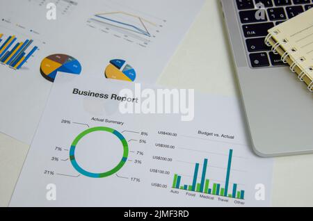 Top view document graph business finance investment marketing with computer laptop on desk. Stock Photo