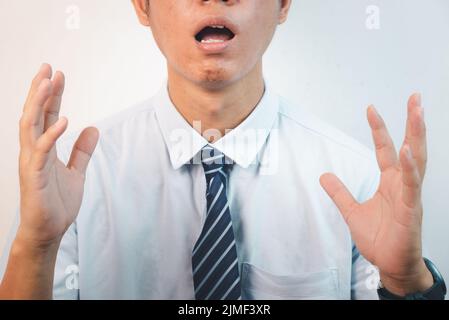 Business man person body language showed hand communication an expression of concern and dissatisfaction on background. Stock Photo