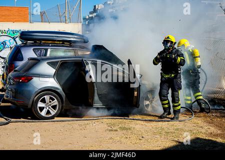 Malaga, Spain. 2nd Aug, 2022. Firefighters put out a car fire at Calle Pacifico, Madrid. The fire started in the engine of one of the cars and then spread to the car next door. Two vehicles were damaged by the fire. There was no personal injury. (Credit Image: © Francis Gonzalez/SOPA Images via ZUMA Press Wire) Stock Photo