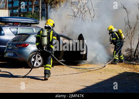 Malaga, Spain. 2nd Aug, 2022. Firefighters put out a car fire at Calle Pacifico, Madrid. The fire started in the engine of one of the cars and then spread to the car next door. Two vehicles were damaged by the fire. There was no personal injury. (Credit Image: © Francis Gonzalez/SOPA Images via ZUMA Press Wire) Stock Photo