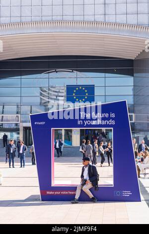 Brussels , Belgium - March 24, 2022: Street view of square in front of European Parliament building in Burssels. Stock Photo