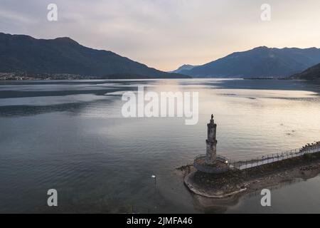 Aerial view of Lake of Como in Port of Gera Lario. Harbor entrance with Madonna on top of the tower. Italy Stock Photo