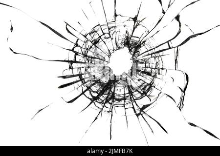 Shot hole, texture of cracks on the glass. Broken windshield. Stock Photo