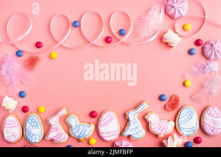 Homemade Easter cookies on pink background flat top view Stock Photo