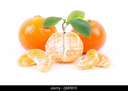 Tangerines with leaves and slices on white background Stock Photo