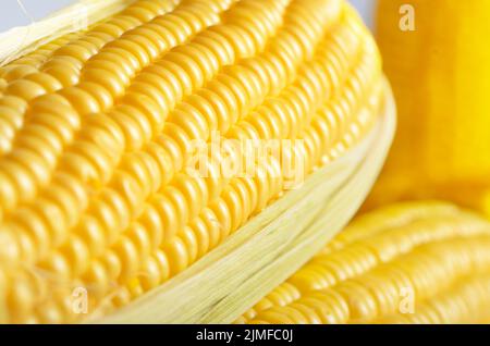 Ripe fresh organic sweet corncob with leaf closeup background Stock Photo