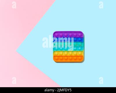 Popit toy on blue background, copy space, top view Stock Photo
