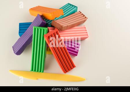 children color wax plasticine for creativity isolated on a white background Stock Photo