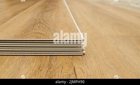 Click vinyl flooring to install yourself in the living room of an apartment Stock Photo