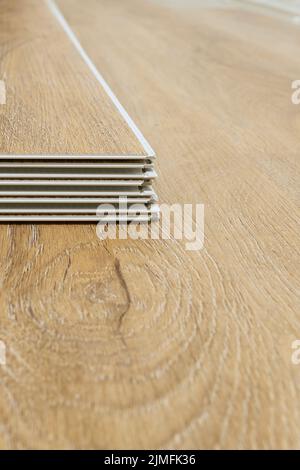 Click vinyl flooring to install yourself in the living room of an apartment Stock Photo