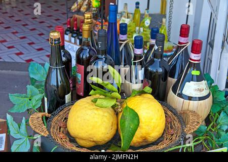 Specialities of the region, lemons, wine, decoration of a small shop at the promenade of Capri town, Capri island,  Gulf of Naples, Italy, Europe Stock Photo