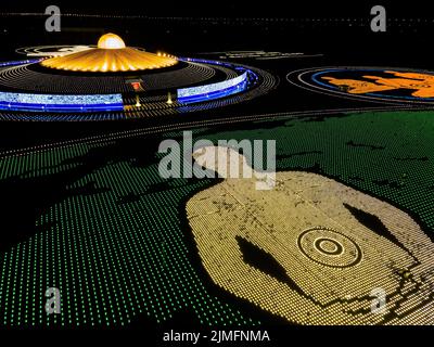 (EDITORS NOTE: Image taken with drone) Aerial view of 100,000 LED lamps in the shape of monks meditating during a mass meditation ceremony to promote world peace at Wat Phra Dhammakaya. Wat Phra Dhammakaya commemorates the World Fellowship of Buddhist Youth (WFBY) 'World Meditation Day' by meditating together for peace and lighting 100,000 LEDs at their temple in Pathum Thani. (Photo by Matt Hunt / SOPA Images/Sipa USA) Stock Photo