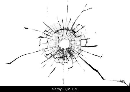 Shot hole, texture of cracks on the glass. Broken windshield. Damaged car window Stock Photo