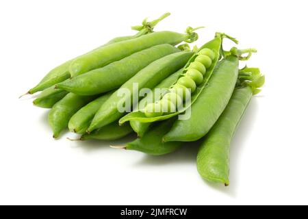 Young pea pods isolated on white background. Full focus. Stock Photo
