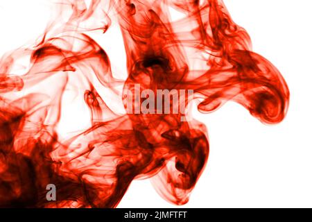Abstract red smoke spot blurred on white background. Stock Photo