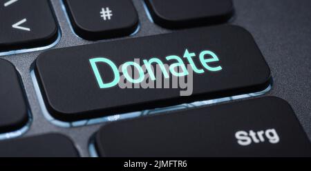 Illuminated keyboard with a labeled key - Donate Stock Photo