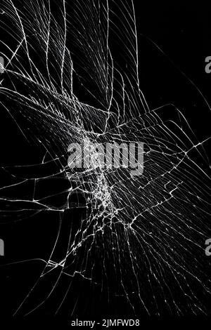 Cracked broken glass screen protection of smartphone or tablet. Damaged screen effect Stock Photo