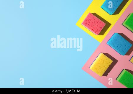 House cleaning sponges on blue background Stock Photo