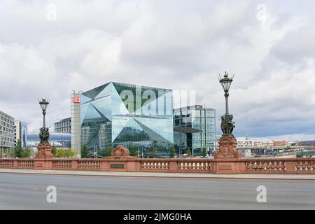 The Cube Berlin office building on Washingtonplatz, with the main train station in Berlin behind it Stock Photo