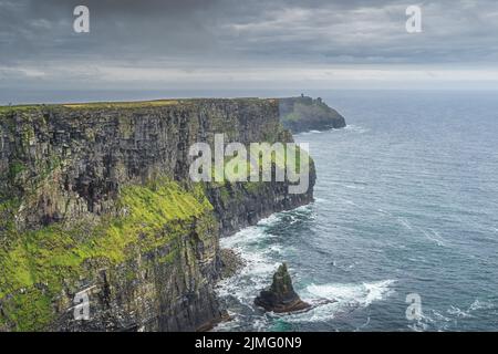 Dramatic storm clouds over iconic Cliffs of Moher, Ireland Stock Photo