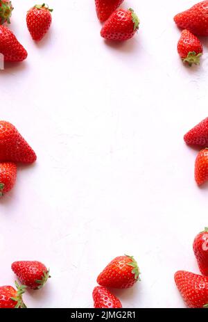 Fresh strawberries pattern on white background. Directly above. Copy space. Stock Photo